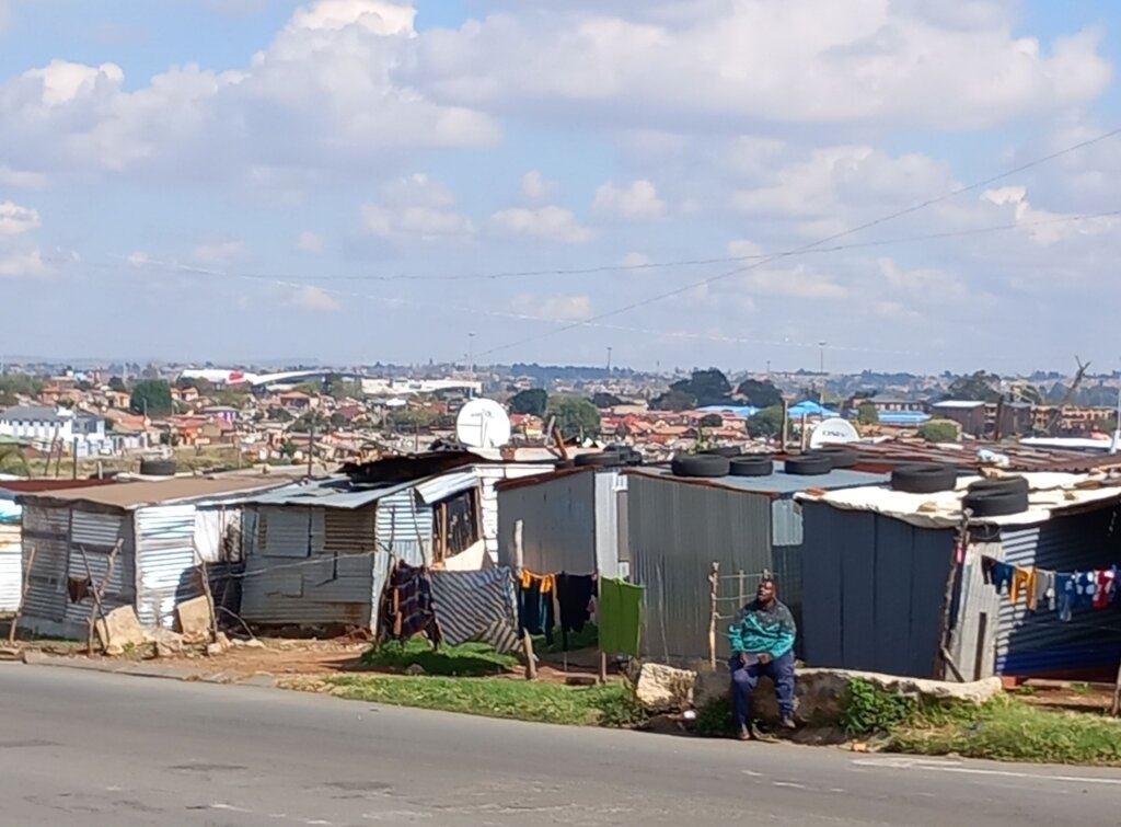 This image shows a poorer area of Soweto with makeshift dwellings built very close together